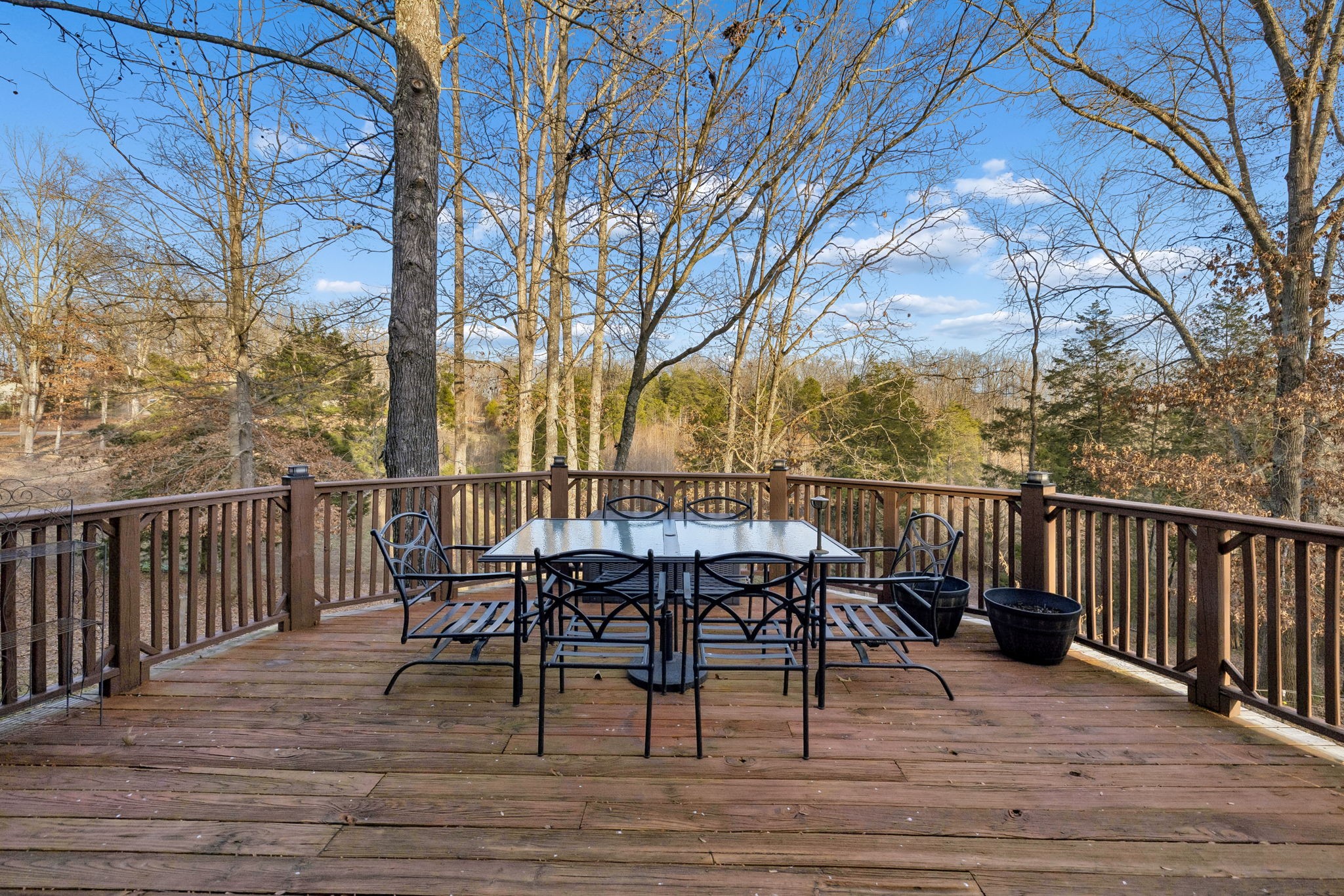 20151 Ben Fly Road Lyles, TN 37098 - Photo 59 of 98 a view of a deck with table and chairs and wooden floor