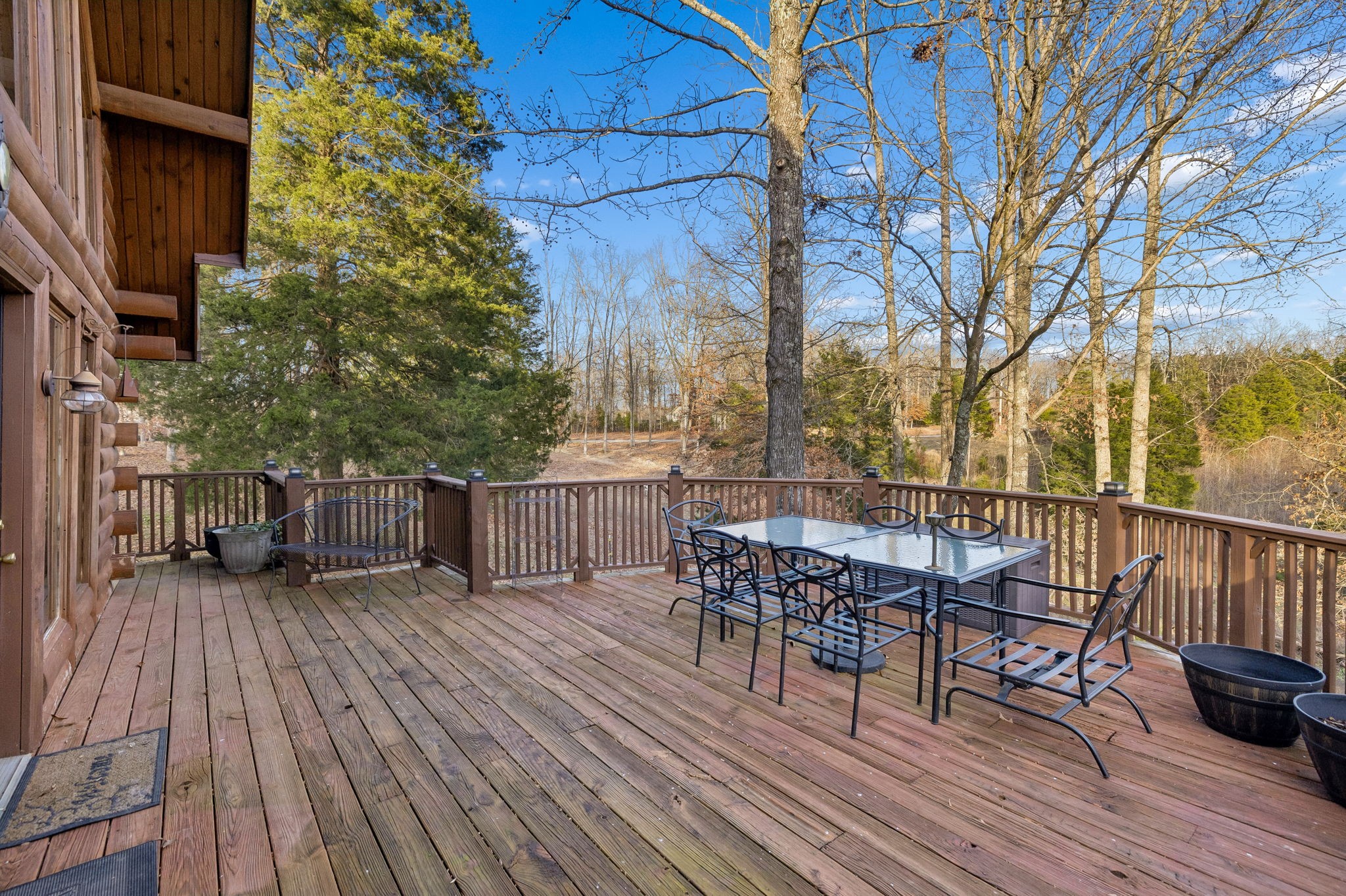 20151 Ben Fly Road Lyles, TN 37098 - Photo 61 of 98 a view of a deck with table and chairs and wooden floor