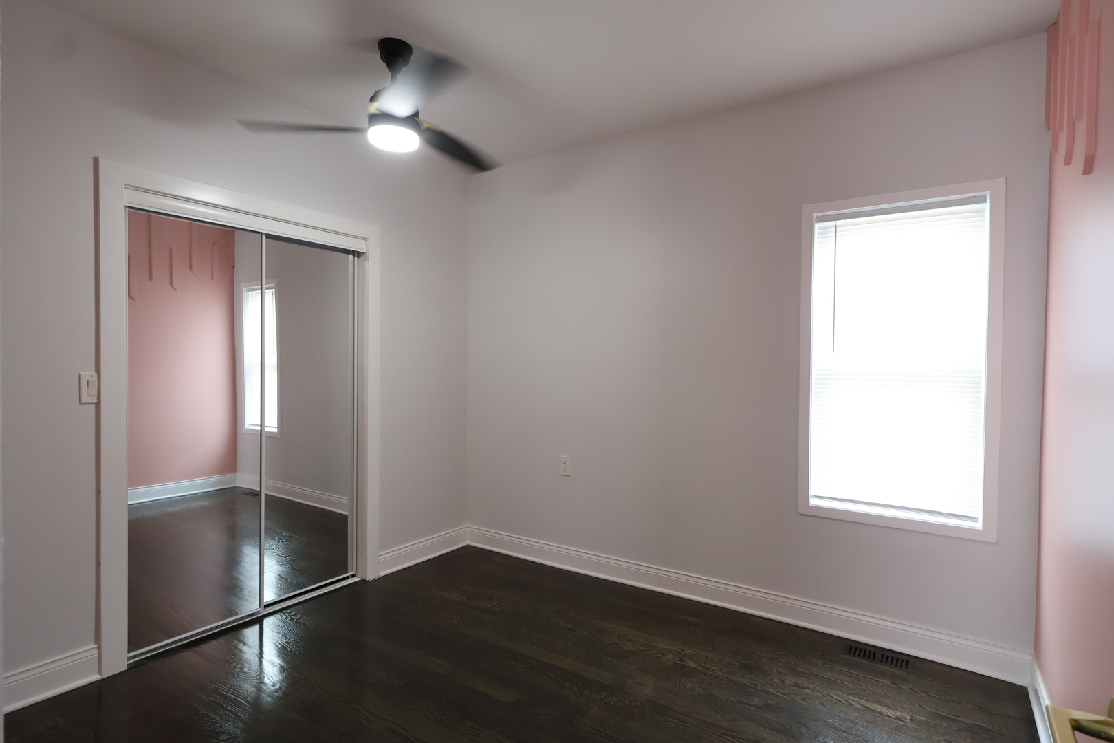 15239 Vincennes Road Phoenix, IL 60426 - Photo 17 of 24 an empty room with wooden floor closet and windows