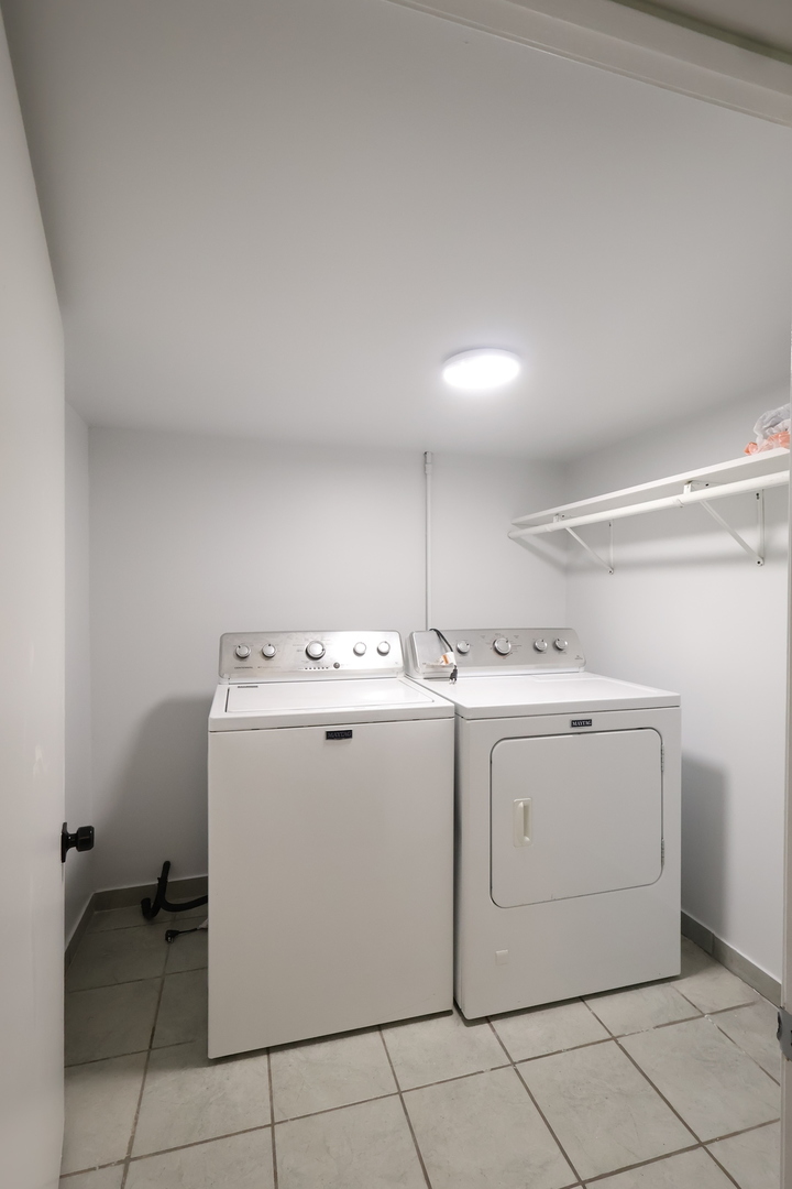 15239 Vincennes Road Phoenix, IL 60426 - Photo 24 of 24 a utility room with dryer and washer