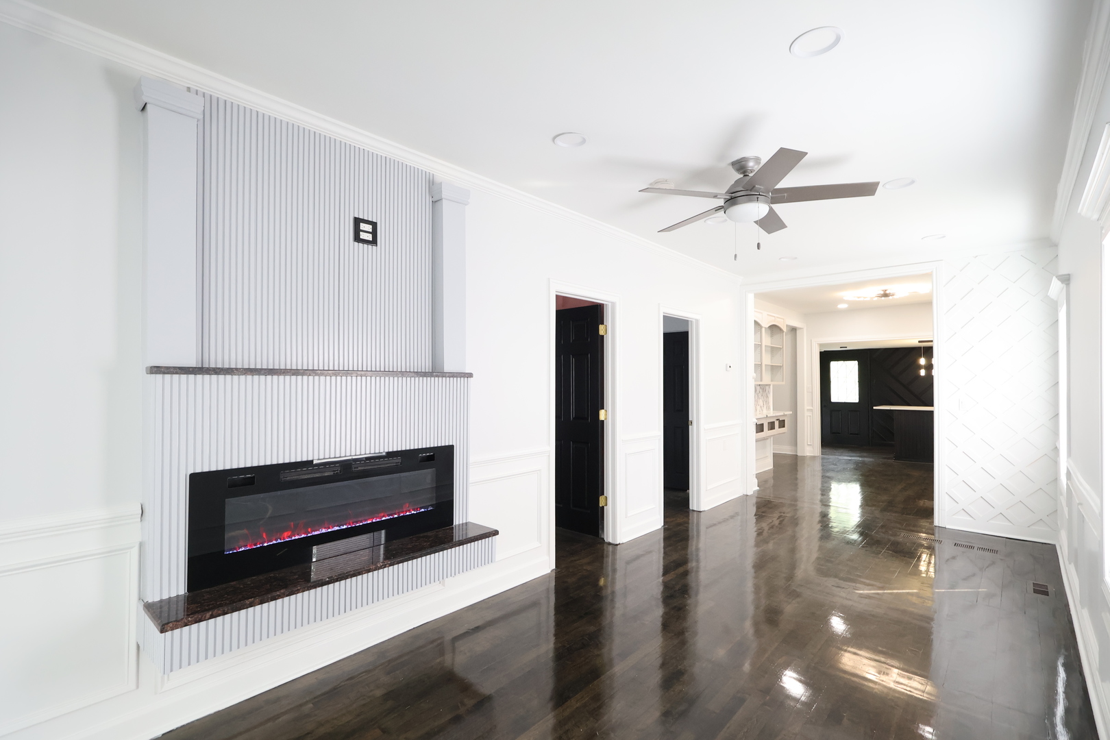 15239 Vincennes Road Phoenix, IL 60426 - Photo 6 of 24 a view of livingroom with hardwood floor and a ceiling fan