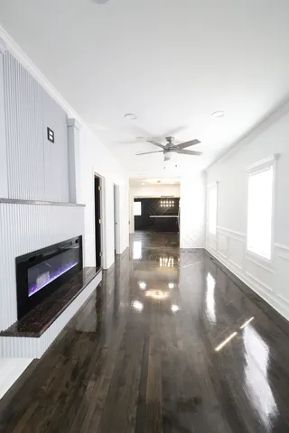a view of open kitchen stove microwave and cabinets