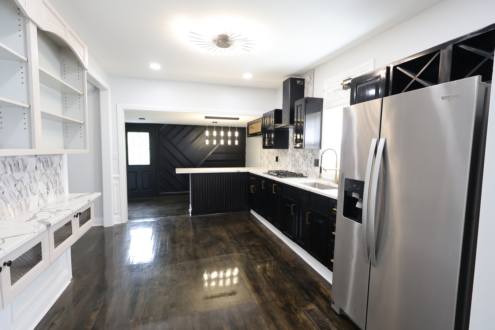 15239 Vincennes Road Phoenix, IL 60426 - Photo 10 of 24 a kitchen with stainless steel appliances a refrigerator and wooden floor