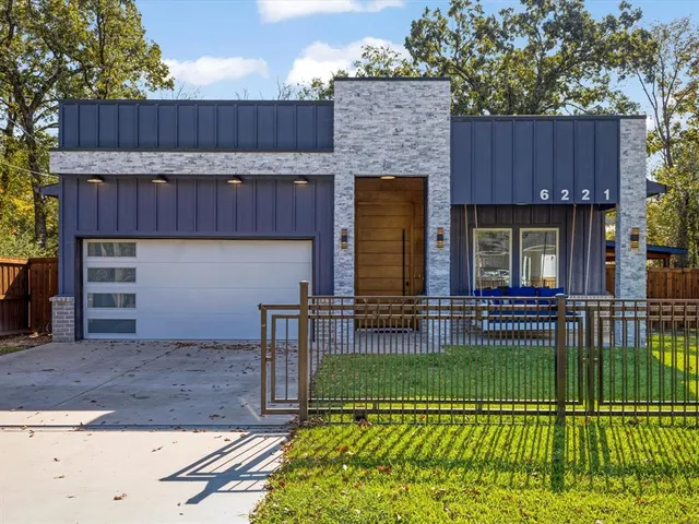a view of a house with a sink and a yard