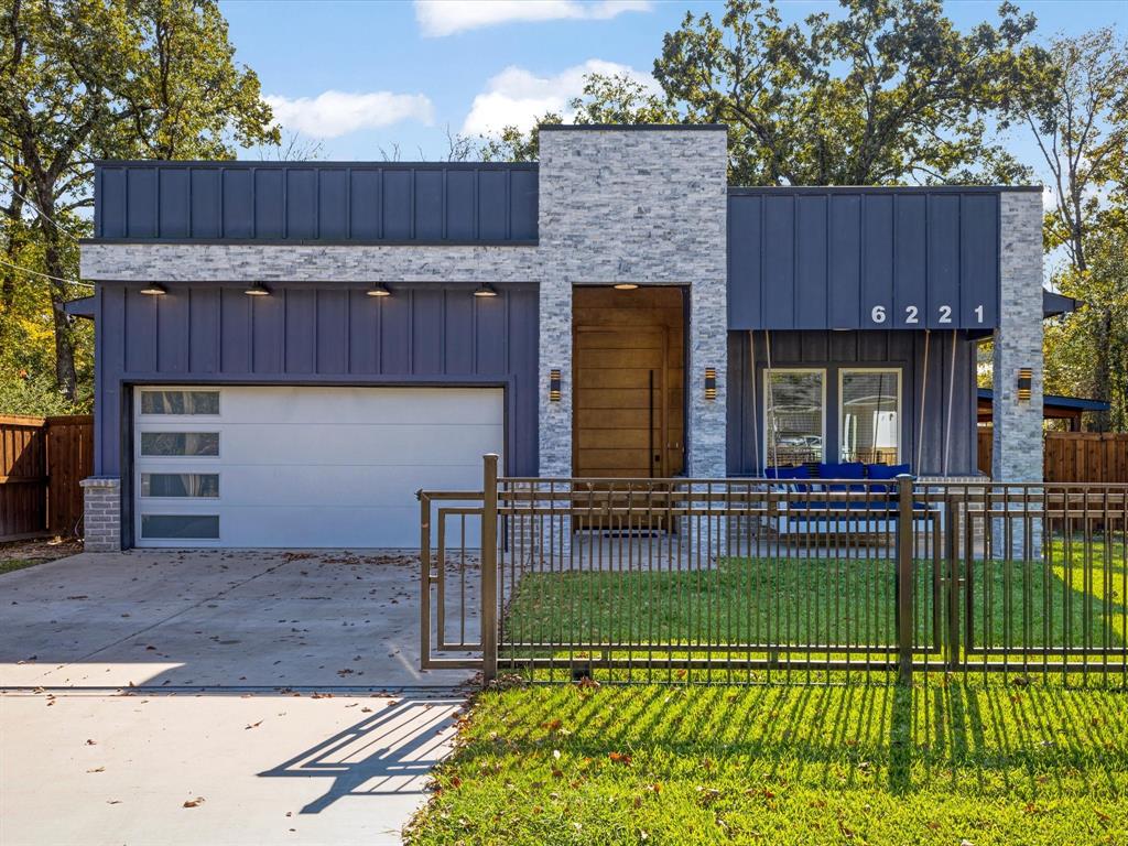 a view of a house with a sink and a yard