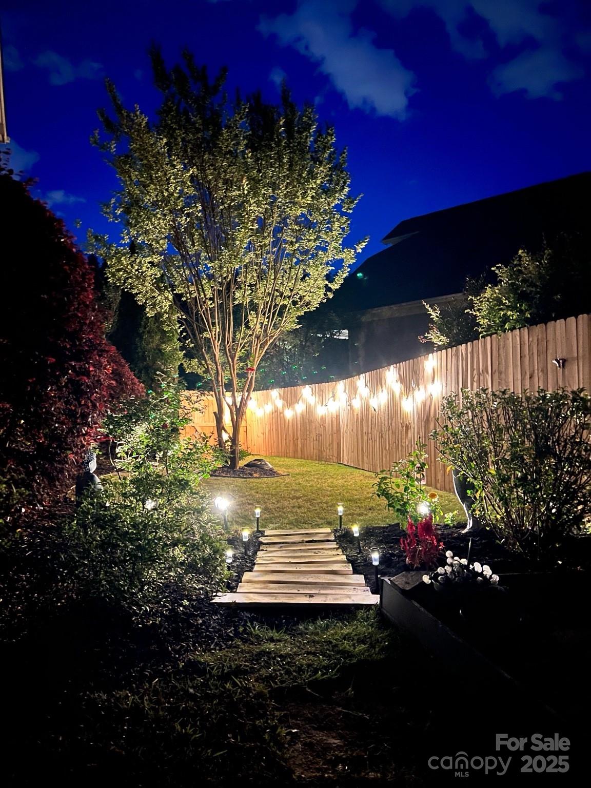 a view of a fountain in front of a house