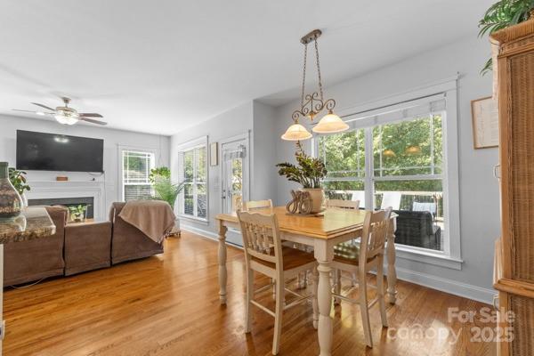 1761 Lakeland Trail Drive Tega Cay, SC 29708 - Photo 16 of 46 a view of a dining room with furniture window and wooden floor
