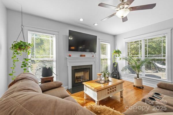 1761 Lakeland Trail Drive Tega Cay, SC 29708 - Photo 19 of 46 a living room with furniture a flat screen tv and a fireplace