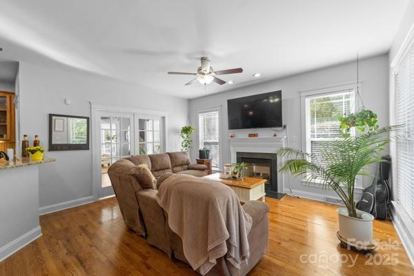 1761 Lakeland Trail Drive Tega Cay, SC 29708 - Photo 20 of 46 a living room with furniture a fireplace and a flat screen tv