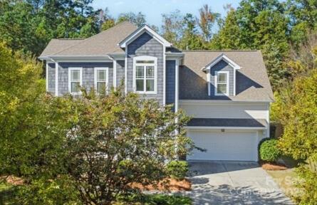 1761 Lakeland Trail Drive Tega Cay, SC 29708 - Photo 2 of 46 a front view of a house with a yard and garage
