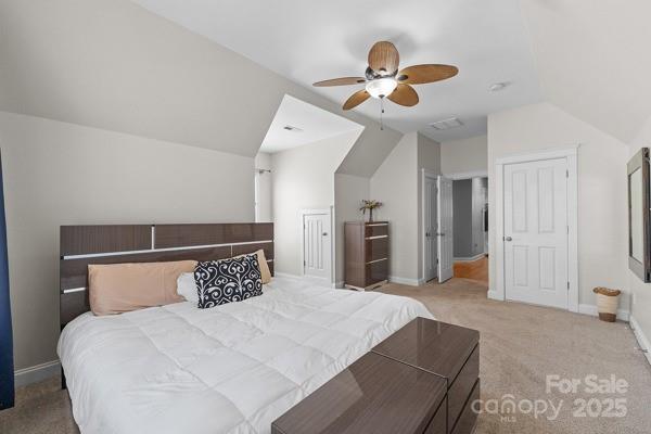 1761 Lakeland Trail Drive Tega Cay, SC 29708 - Photo 24 of 46 a bedroom with a large bed and a chandelier