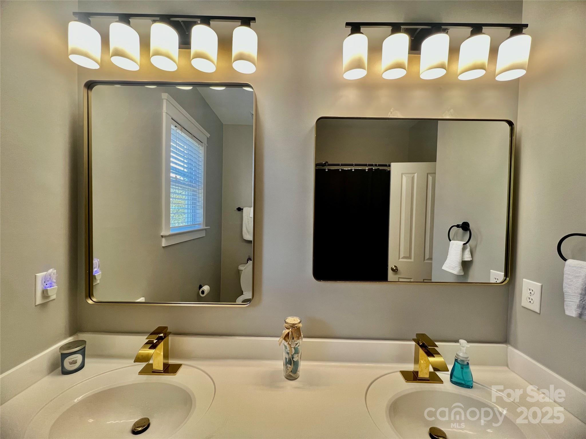 1761 Lakeland Trail Drive Tega Cay, SC 29708 - Photo 26 of 46 a bathroom with a sink and a mirror