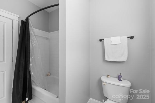 1761 Lakeland Trail Drive Tega Cay, SC 29708 - Photo 27 of 46 a white toilet sitting next to a bathroom sink