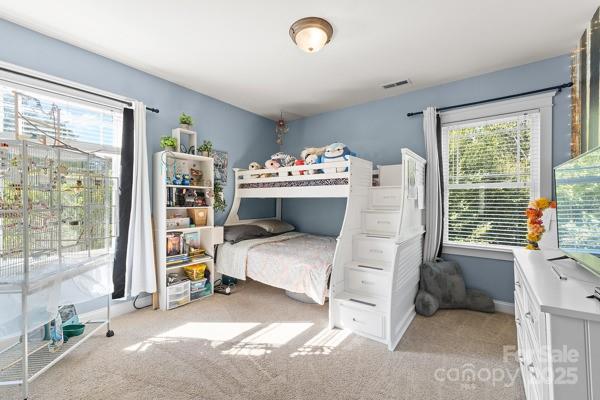 1761 Lakeland Trail Drive Tega Cay, SC 29708 - Photo 30 of 46 a bedroom with furniture and a large window