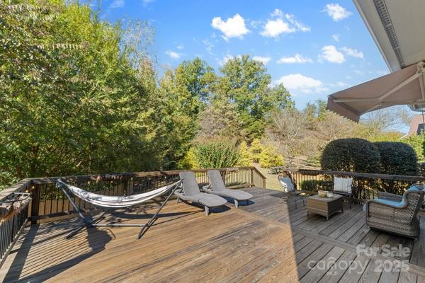 1761 Lakeland Trail Drive Tega Cay, SC 29708 - Photo 36 of 46 a backyard of a house with table and chairs
