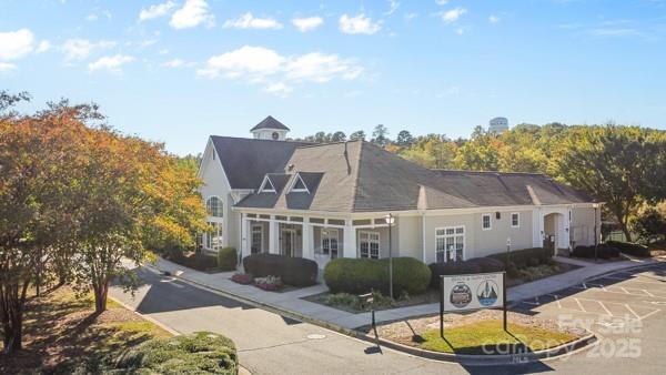 1761 Lakeland Trail Drive Tega Cay, SC 29708 - Photo 41 of 46 a view of a white house with a big yard and large tree