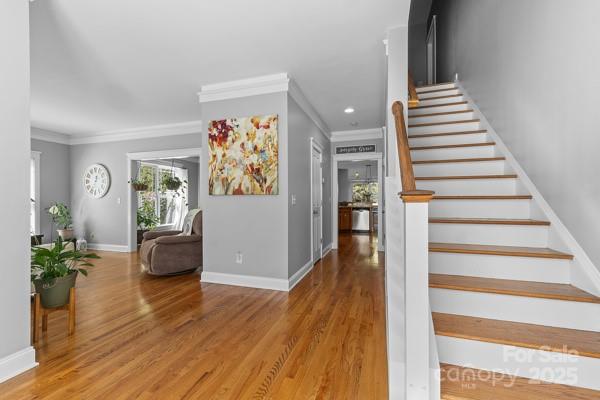 1761 Lakeland Trail Drive Tega Cay, SC 29708 - Photo 6 of 46 a view of a hallway with wooden floor and stairs