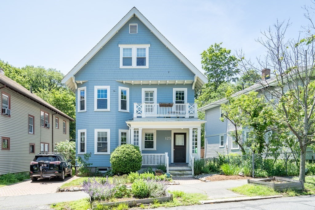 125 Sumner Road, Unit 1 Brookline, MA 02445 - Photo 1 of 22 a front view of a house with garden
