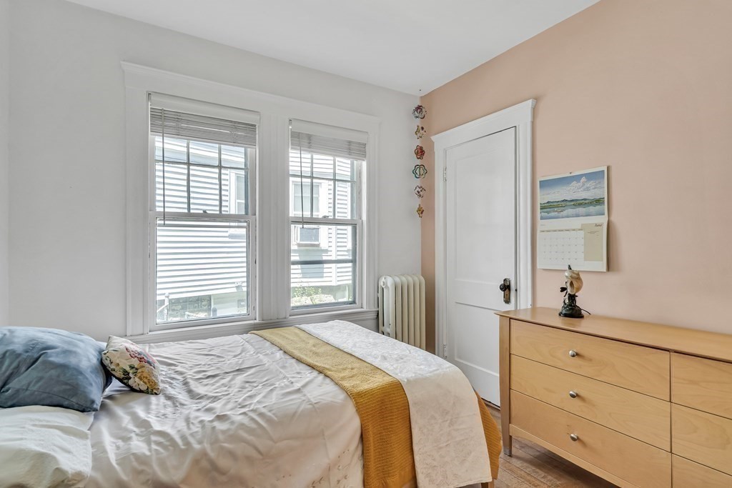 125 Sumner Road, Unit 1 Brookline, MA 02445 - Photo 15 of 22 a bedroom with a bed and a window