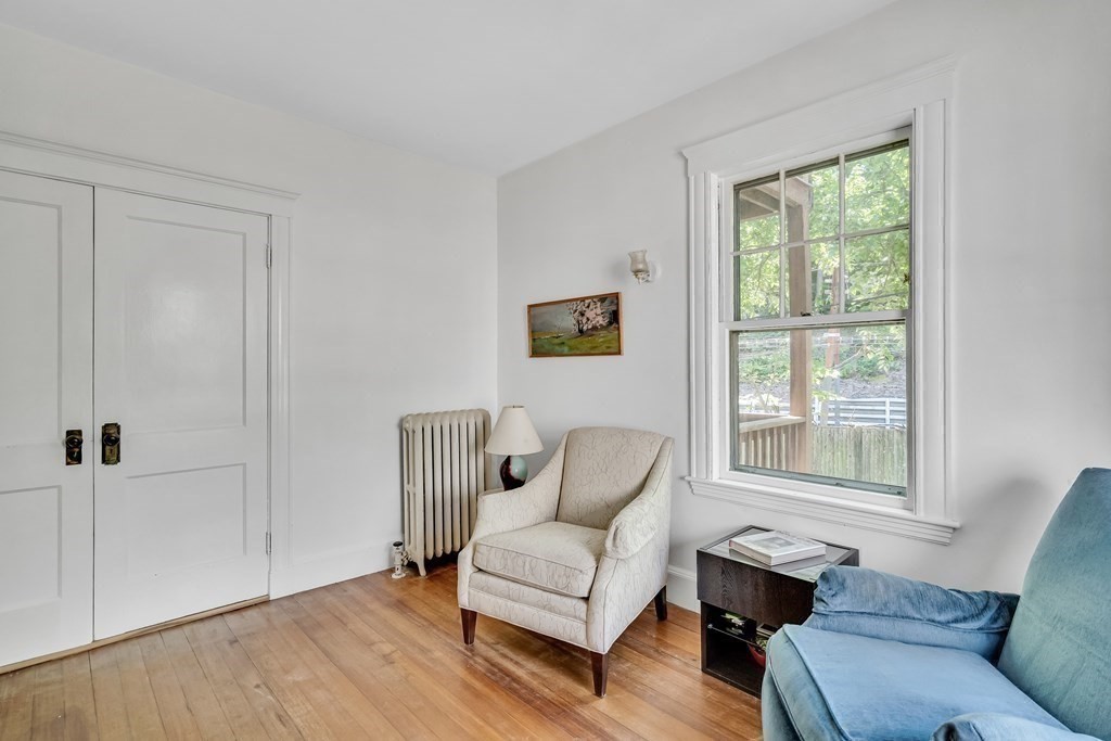 125 Sumner Road, Unit 1 Brookline, MA 02445 - Photo 17 of 22 a living room with furniture and a window