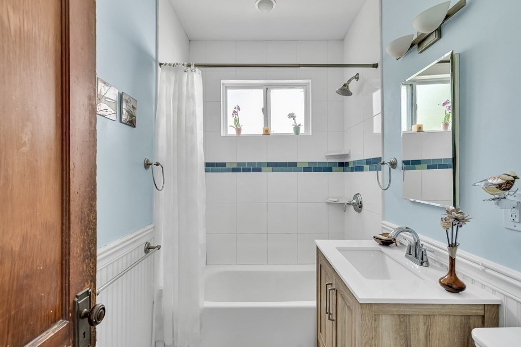 125 Sumner Road, Unit 1 Brookline, MA 02445 - Photo 19 of 22 a bathroom with a sink a toilet and shower