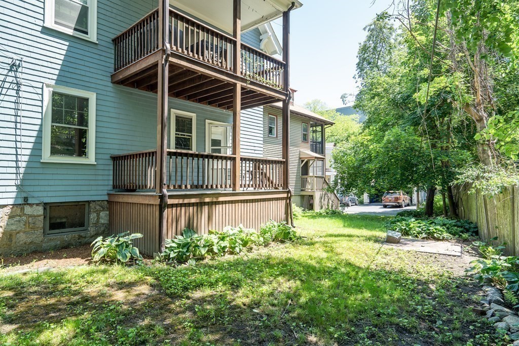 125 Sumner Road, Unit 1 Brookline, MA 02445 - Photo 22 of 22 a front view of a house with garden