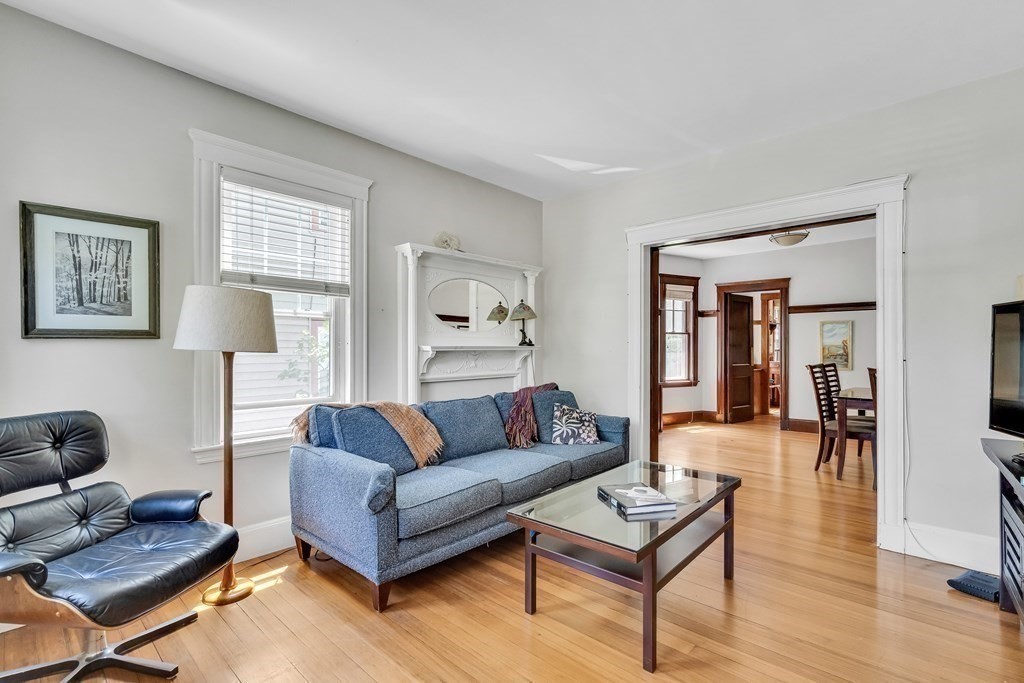 125 Sumner Road, Unit 1 Brookline, MA 02445 - Photo 6 of 22 a living room with furniture a rug and a window