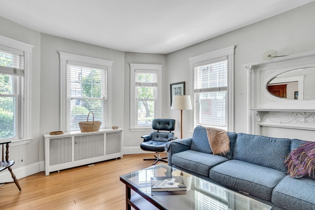 125 Sumner Road, Unit 1 Brookline, MA 02445 - Photo 7 of 22 a living room with furniture and a large window