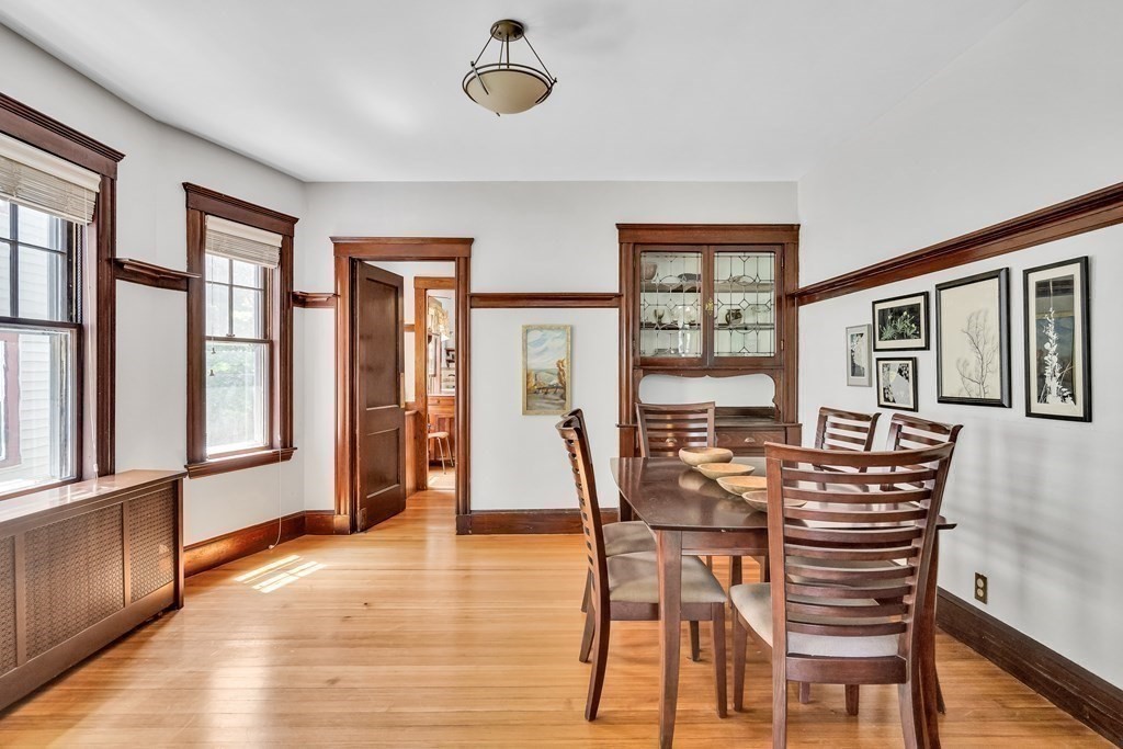 125 Sumner Road, Unit 1 Brookline, MA 02445 - Photo 8 of 22 a view of a dining room with furniture window and wooden floor