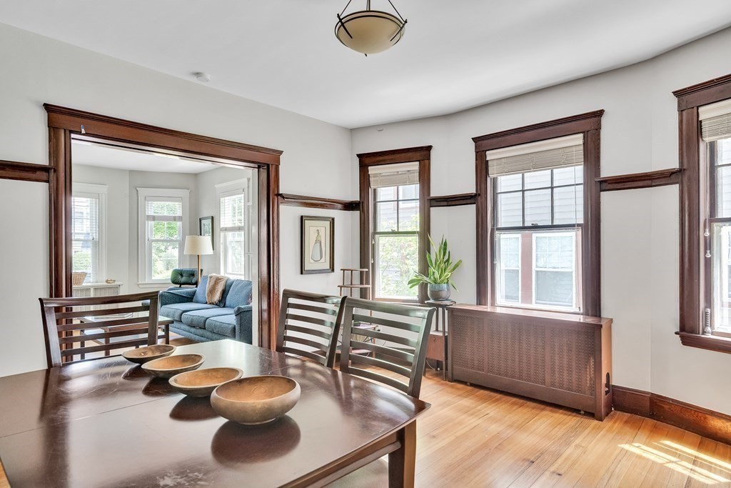 125 Sumner Road, Unit 1 Brookline, MA 02445 - Photo 9 of 22 a living room with furniture and a large window