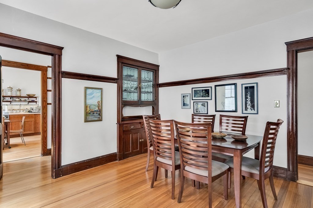 125 Sumner Road, Unit 1 Brookline, MA 02445 - Photo 10 of 22 a view of a dining room with furniture and wooden floor