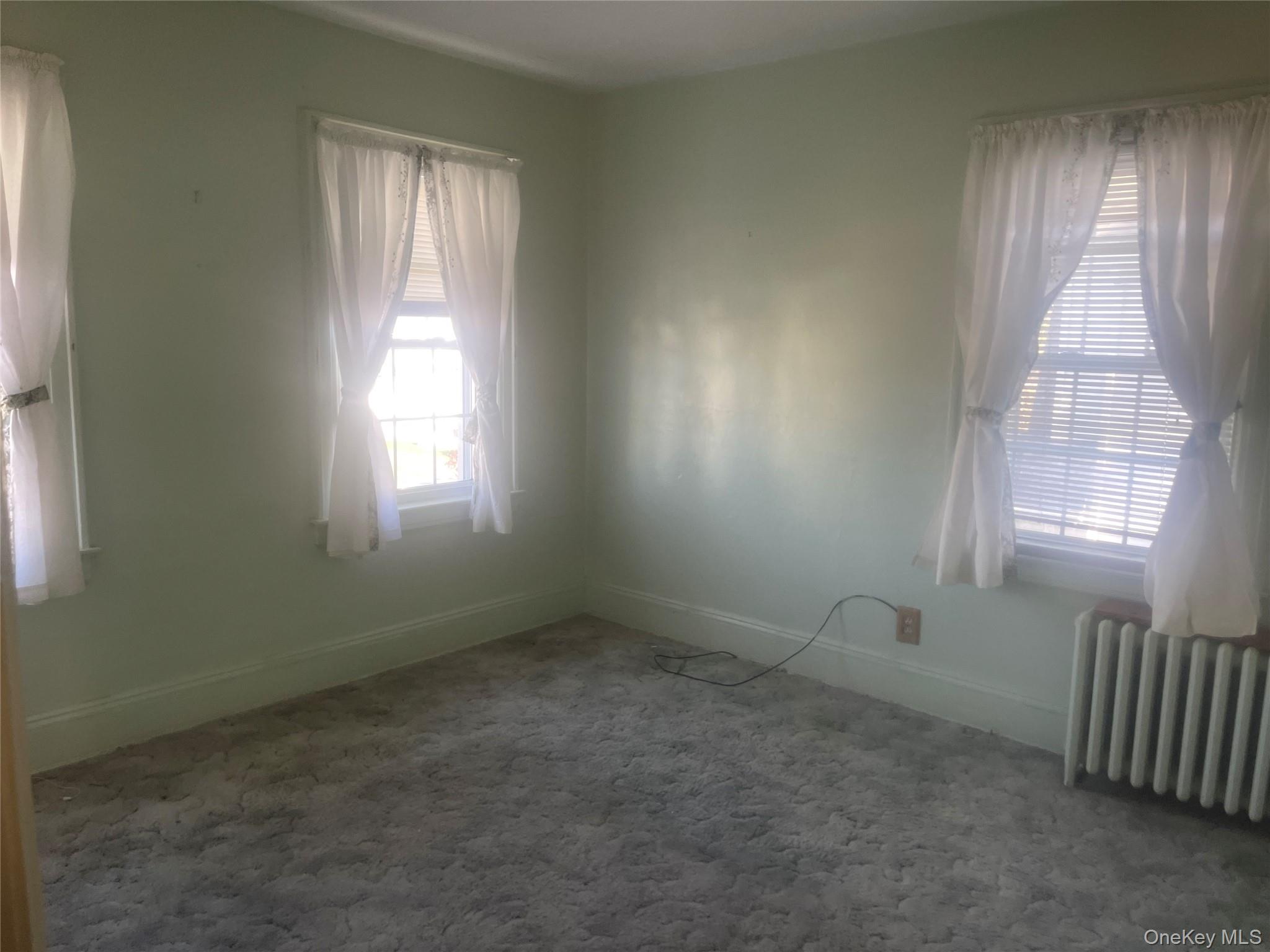 22 Eton Street Valley Stream, NY 11581 - Photo 14 of 30 an empty room with windows