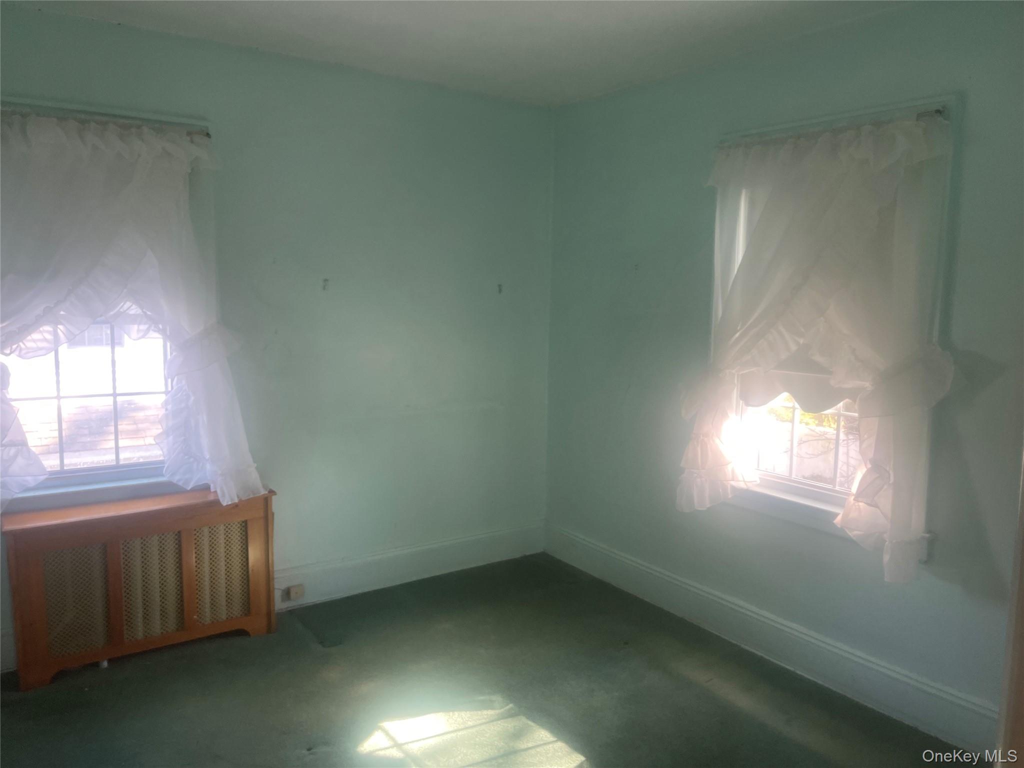 22 Eton Street Valley Stream, NY 11581 - Photo 17 of 30 an empty room with a window