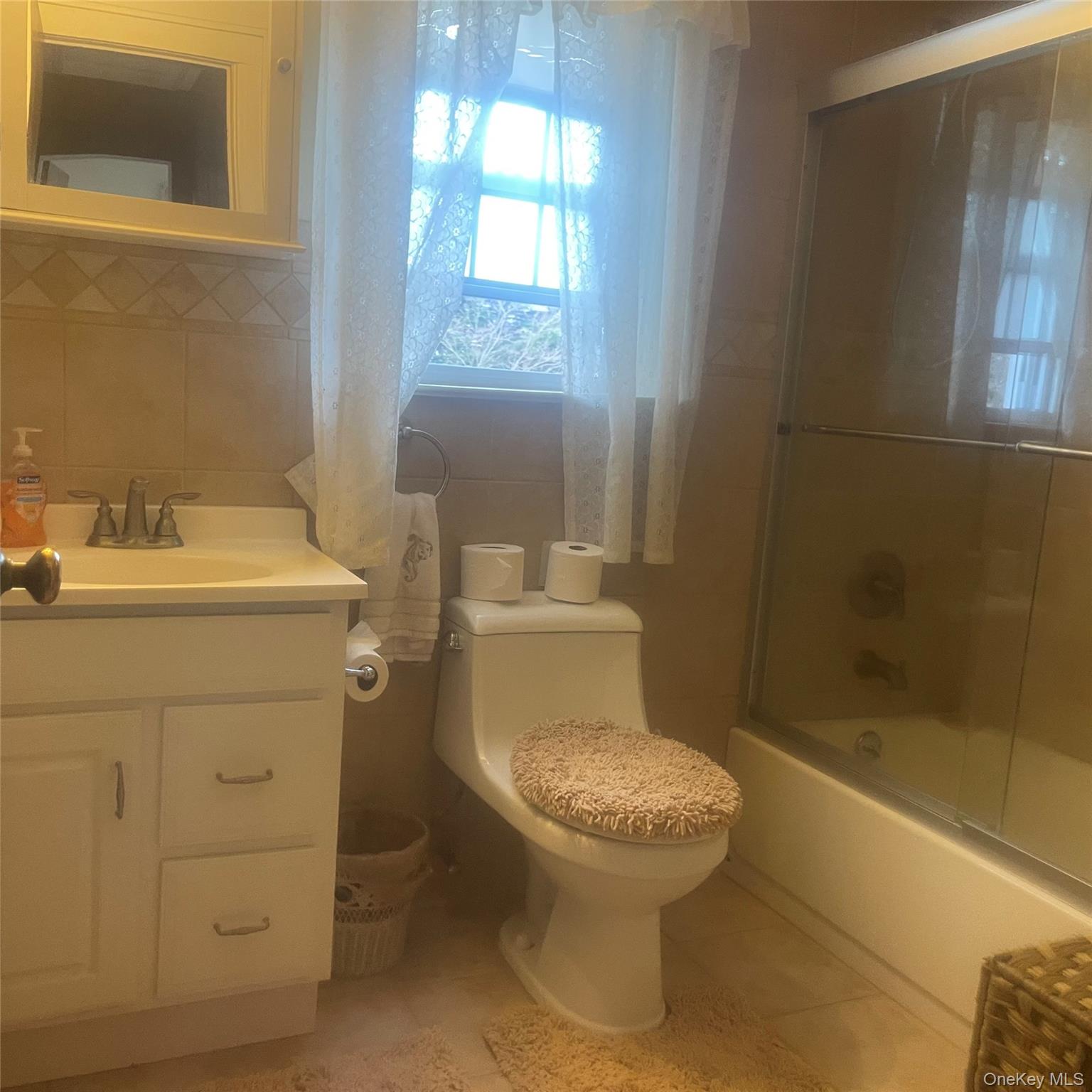 22 Eton Street Valley Stream, NY 11581 - Photo 21 of 30 a bathroom with a sink toilet and shower