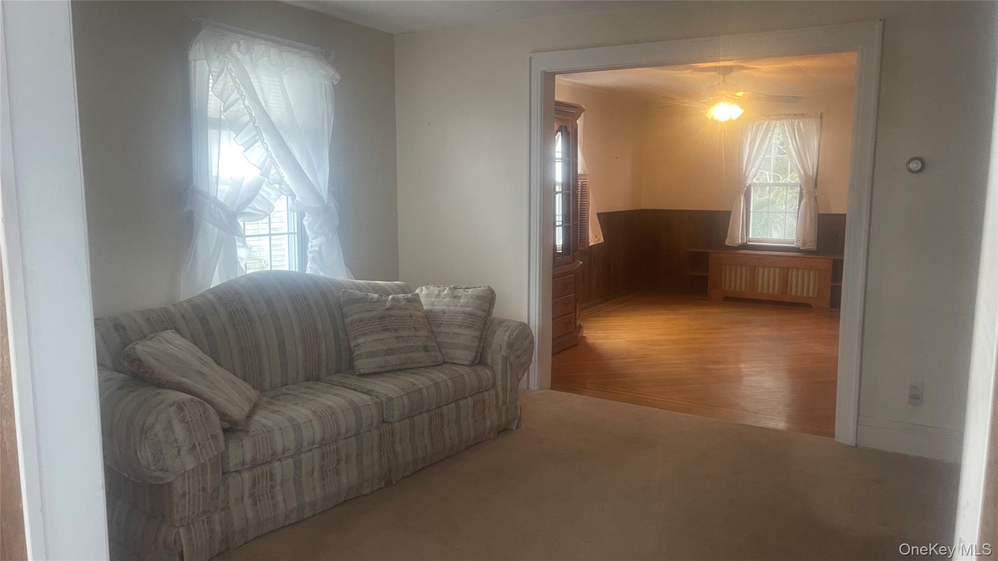 22 Eton Street Valley Stream, NY 11581 - Photo 6 of 30 a living room with furniture and a large window