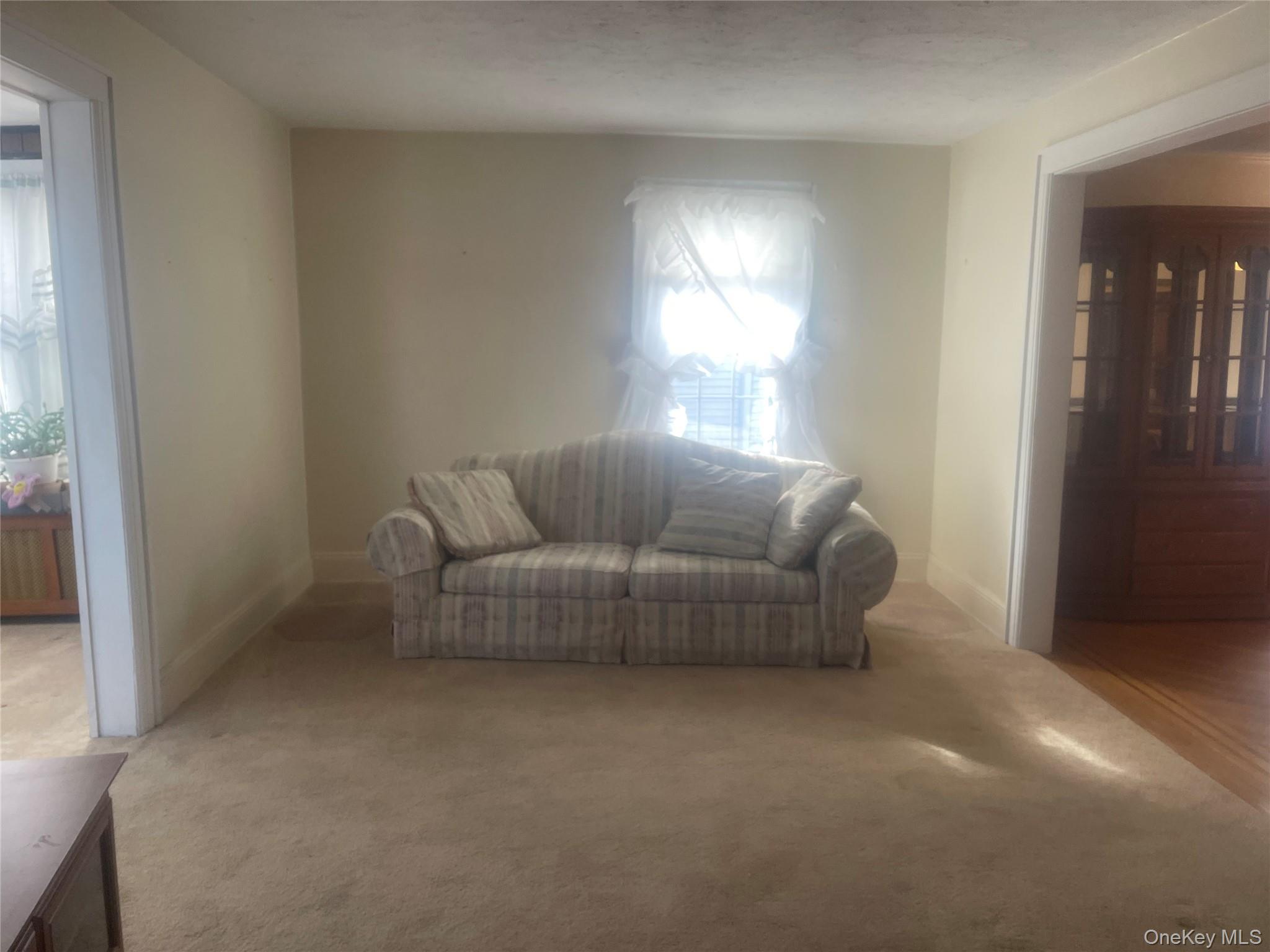 22 Eton Street Valley Stream, NY 11581 - Photo 7 of 30 a living room with furniture and a window