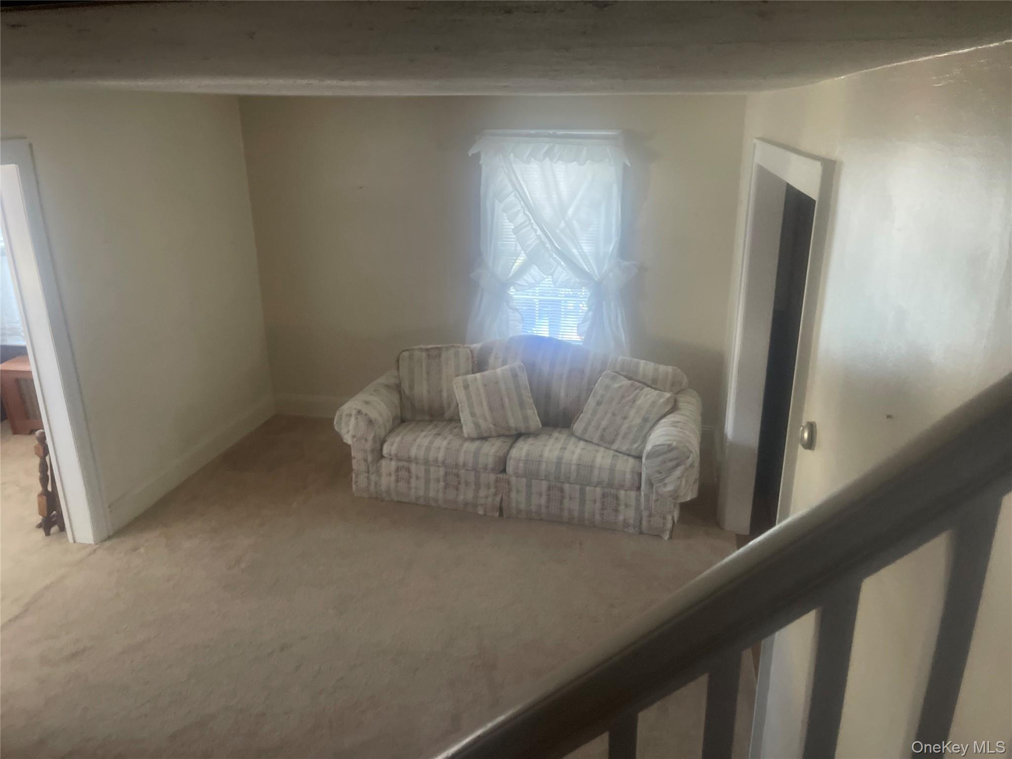22 Eton Street Valley Stream, NY 11581 - Photo 8 of 30 a living room with furniture and a window