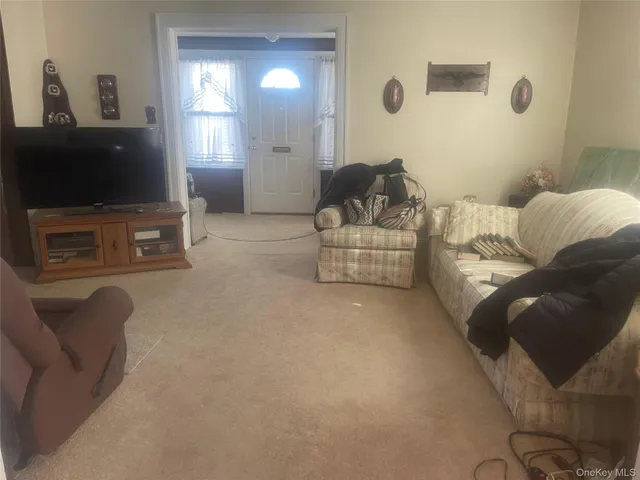 a view of a livingroom with furniture