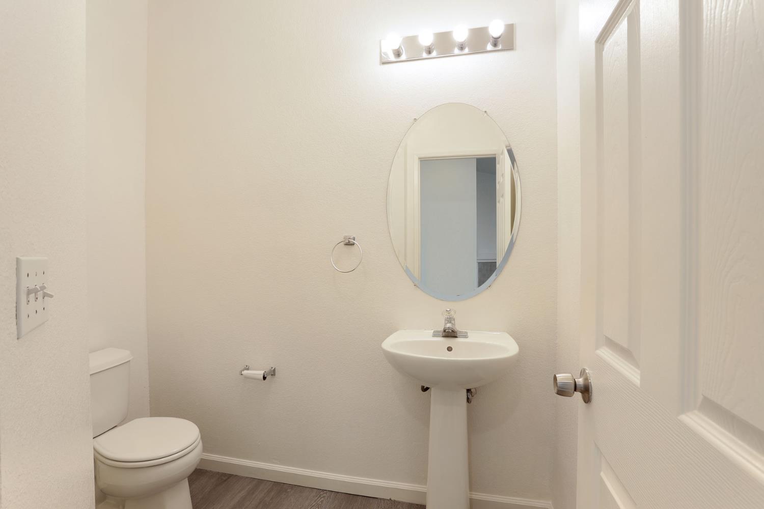 4882 Timepiece Circle Stockton, CA 95219 - Photo 12 of 43 a bathroom with a sink toilet and mirror