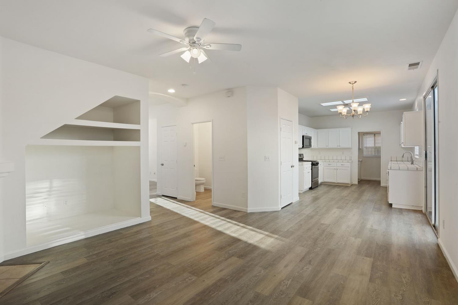 4882 Timepiece Circle Stockton, CA 95219 - Photo 16 of 43 a view of a kitchen with wooden floor and a kitchen