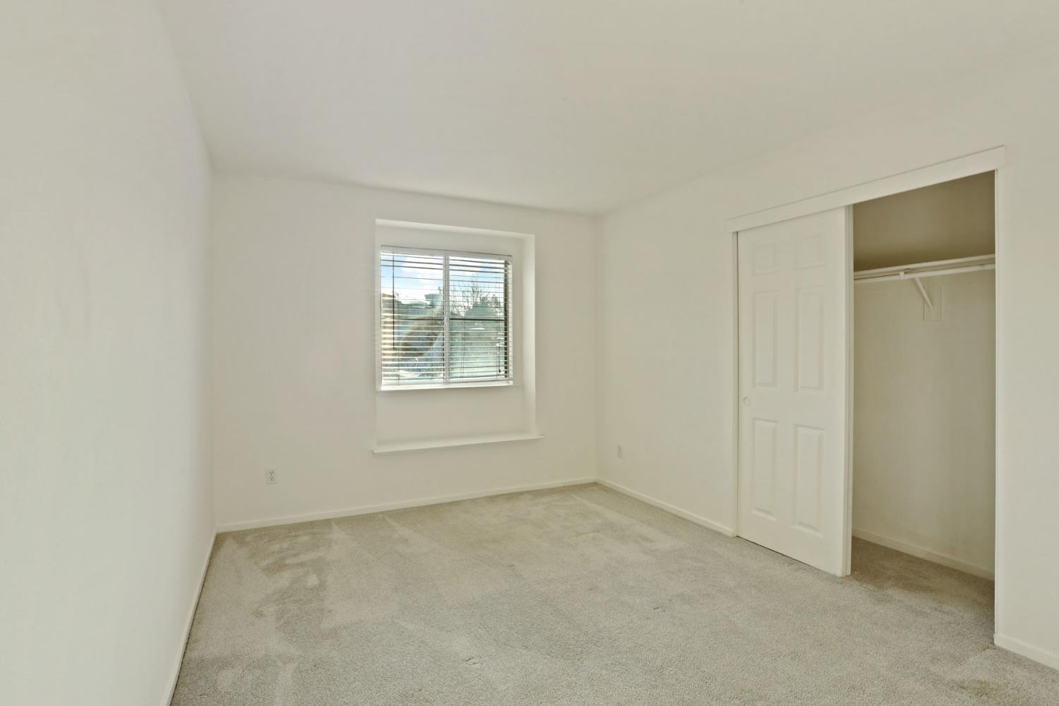4882 Timepiece Circle Stockton, CA 95219 - Photo 26 of 43 an empty room with windows
