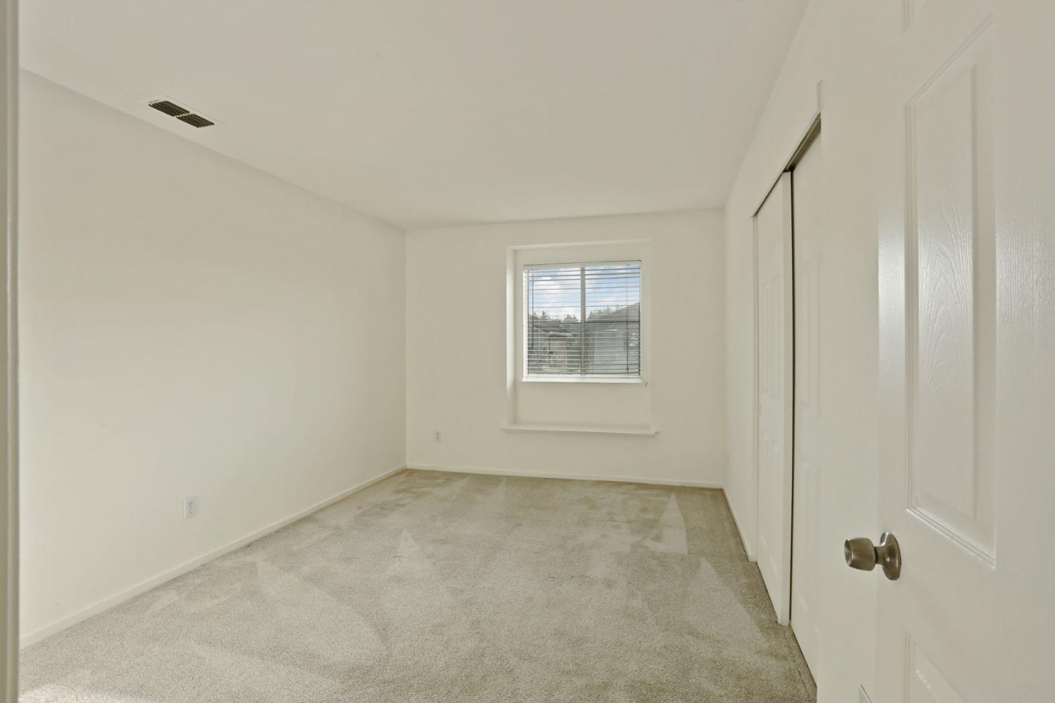 4882 Timepiece Circle Stockton, CA 95219 - Photo 27 of 43 an empty room with windows