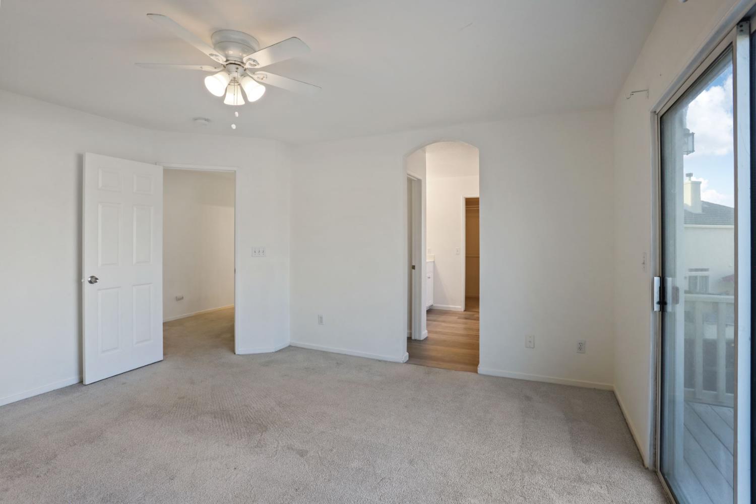 4882 Timepiece Circle Stockton, CA 95219 - Photo 33 of 43 an empty room with chandelier fan