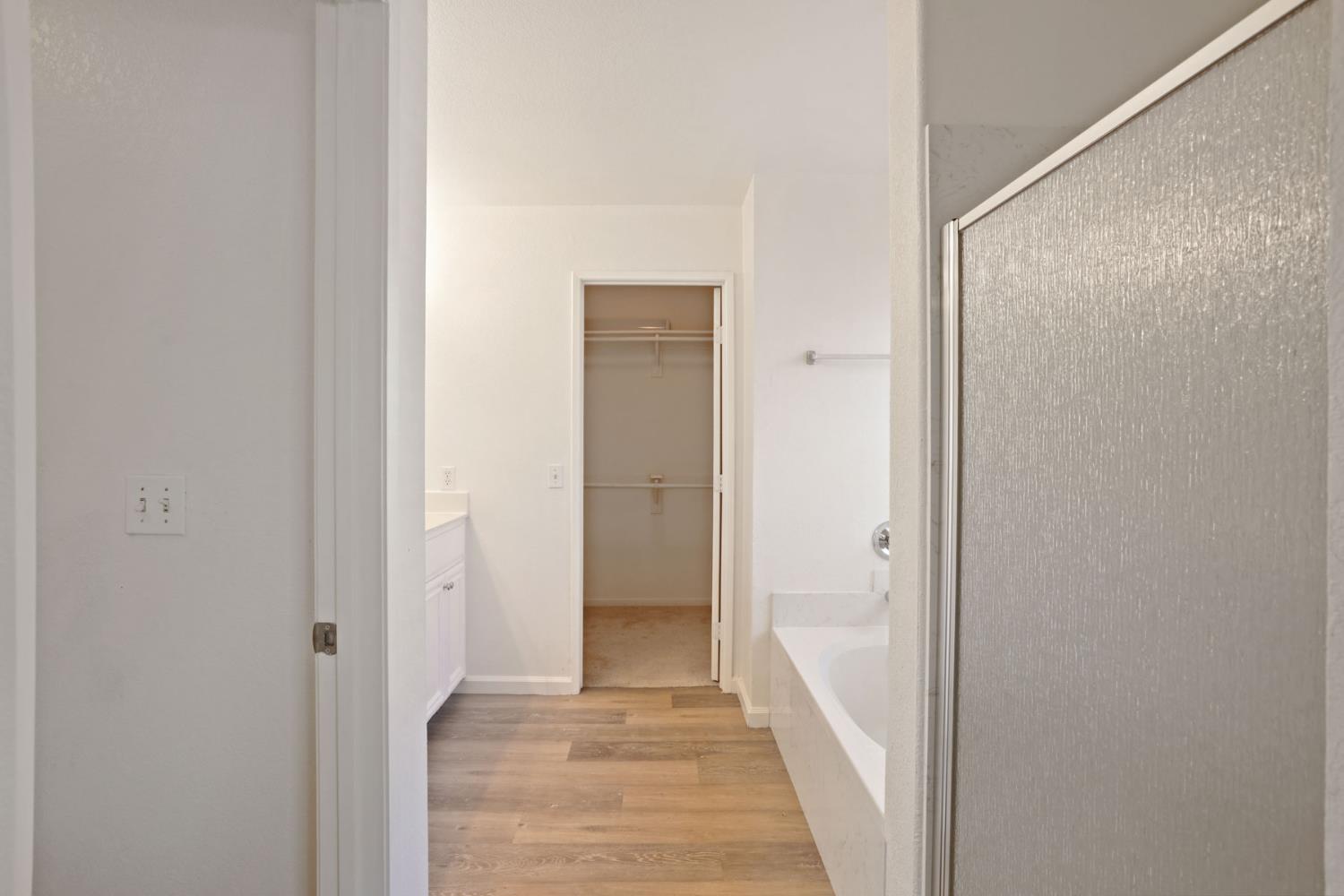 4882 Timepiece Circle Stockton, CA 95219 - Photo 34 of 43 a view of a hallway with wooden floor