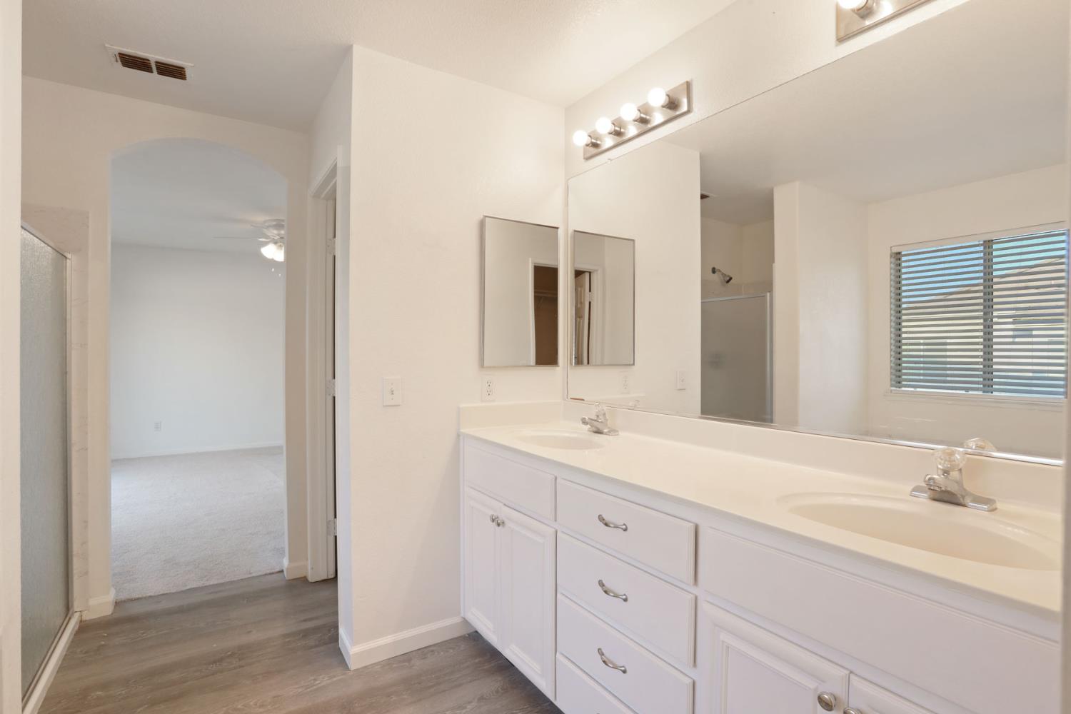 4882 Timepiece Circle Stockton, CA 95219 - Photo 36 of 43 a bathroom with a granite countertop sink double and mirror
