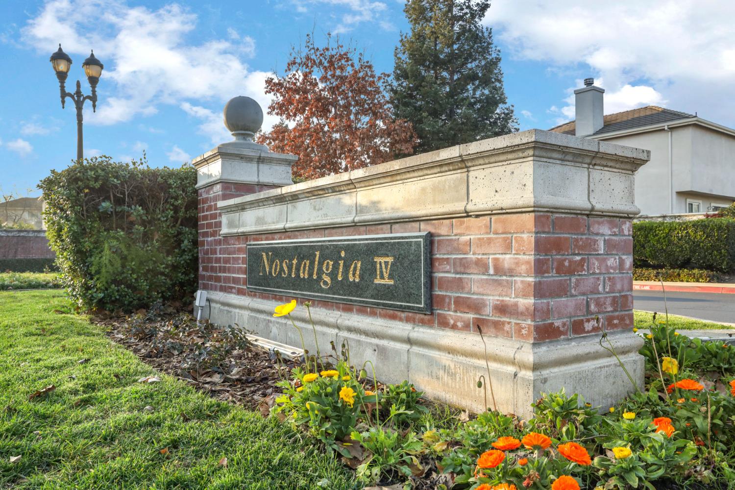 4882 Timepiece Circle Stockton, CA 95219 - Photo 42 of 43 a sign that is sitting in front of flowers