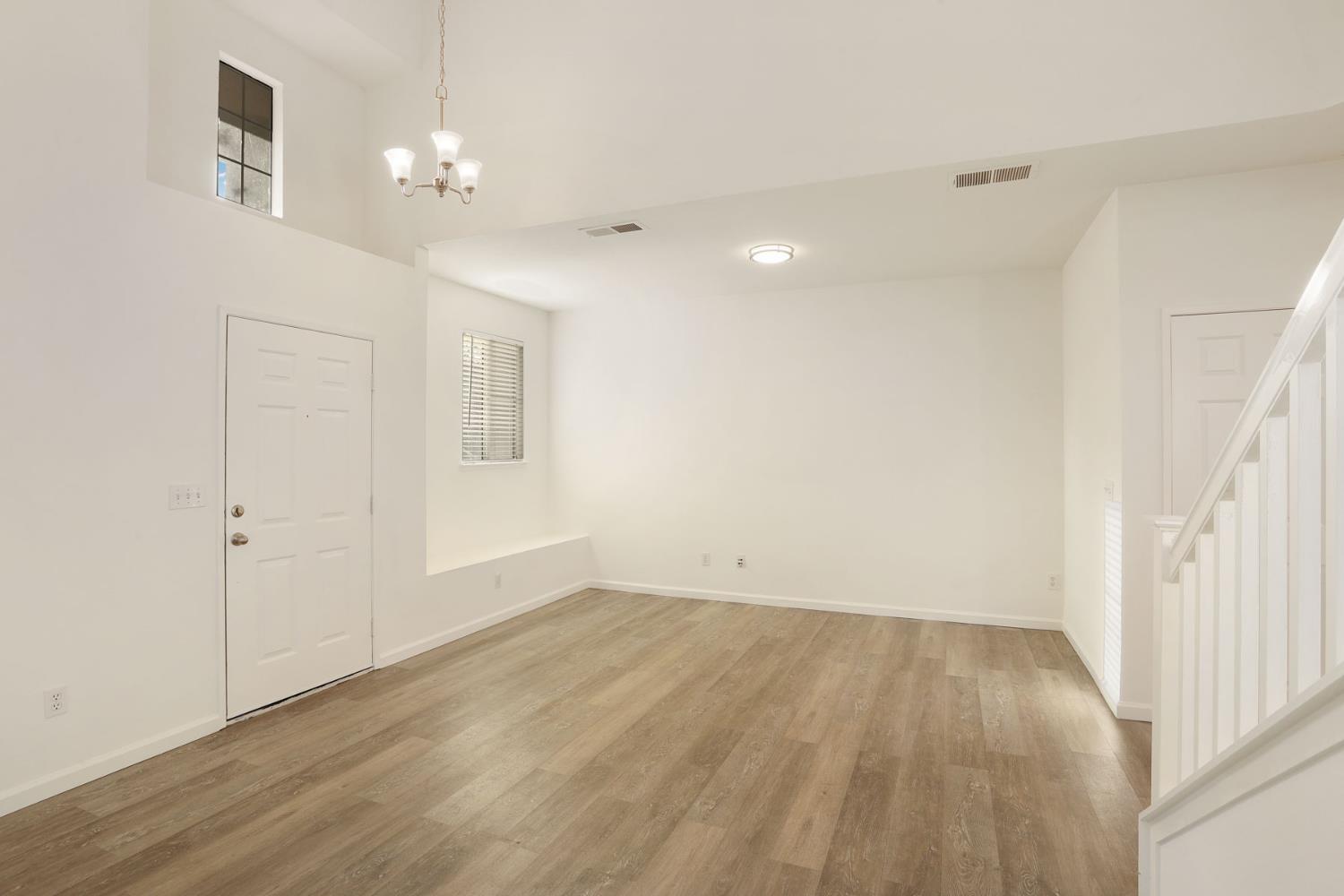 4882 Timepiece Circle Stockton, CA 95219 - Photo 6 of 43 wooden floor in an empty room with a window