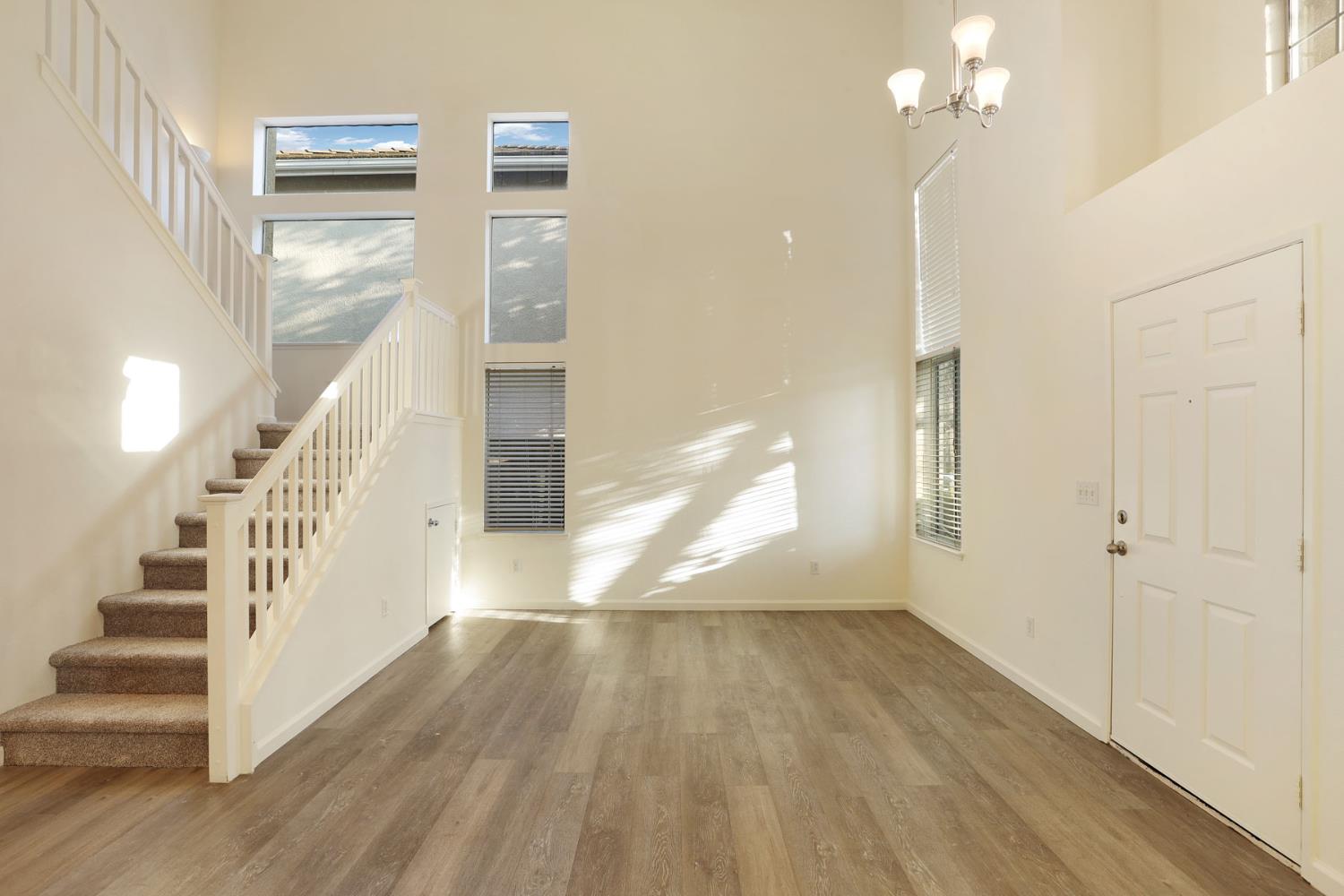 4882 Timepiece Circle Stockton, CA 95219 - Photo 8 of 43 a view of entryway and hall with wooden floor