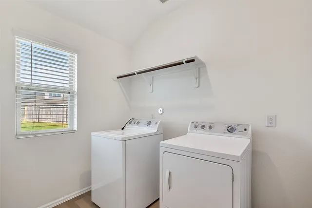 a utility room with dryer and washer