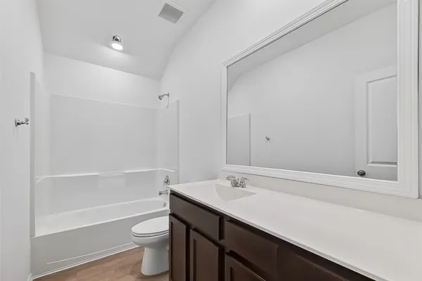 a bathroom with a sink a toilet a shower and a bathtub